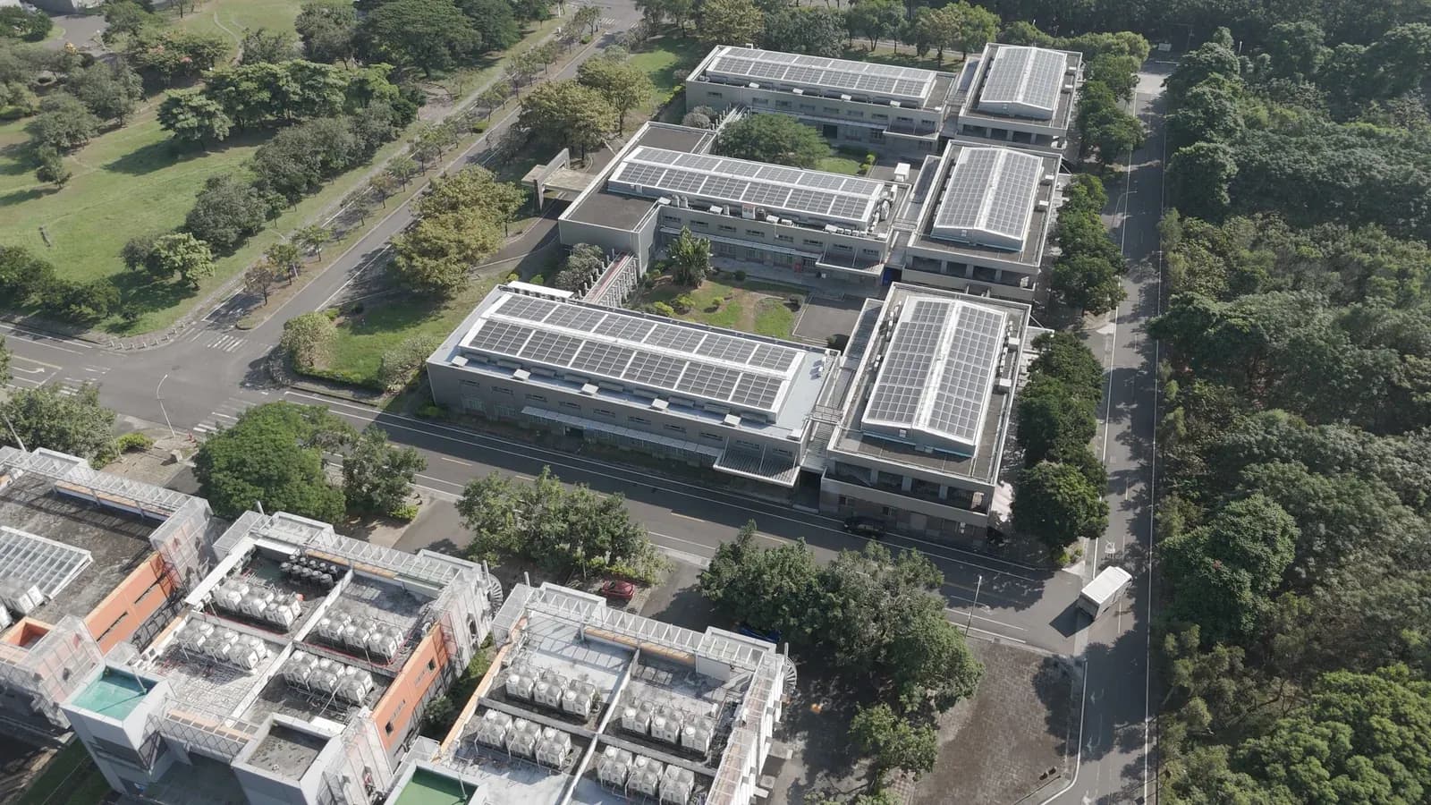 Aerial view of our facility buildings with rooftop solar panels